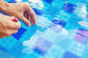 close up of a test tube taking a pool water sample